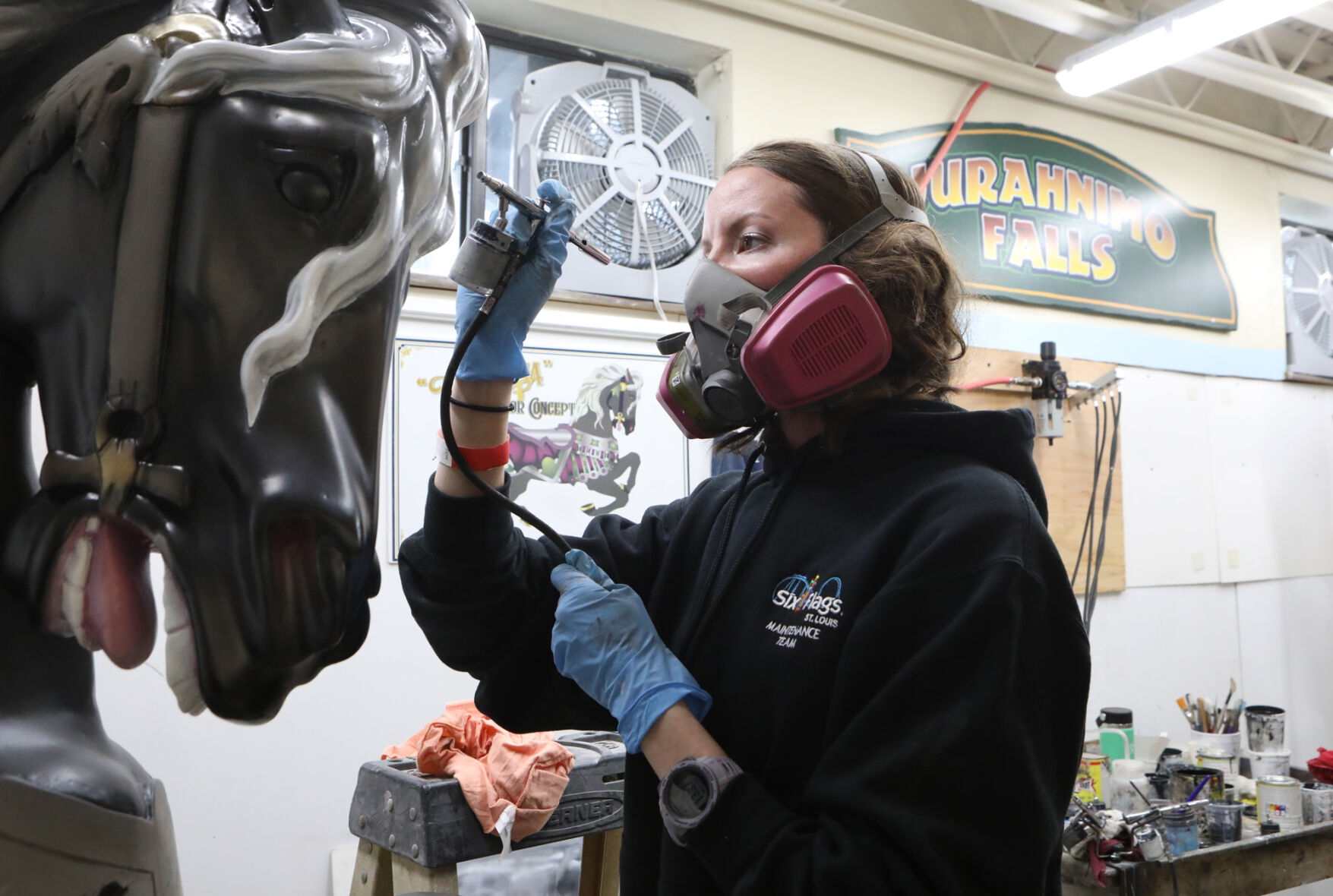 Megan Rhoades airbrushes a horse